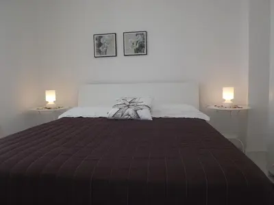 Letto o letti in una camera di Appartanvilla Savalè