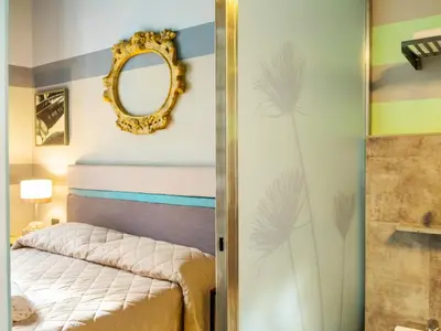 Letto o letti in una camera di Design 4 Rooms