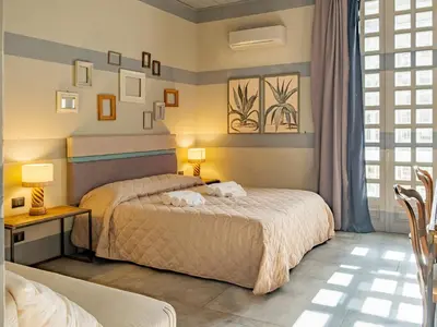Letto o letti in una camera di Design 4 Rooms