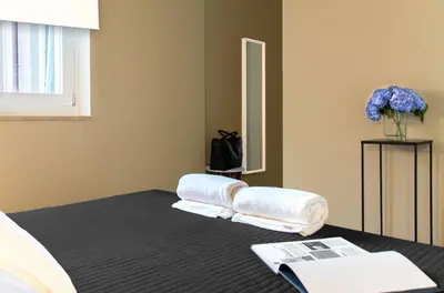 Letto o letti in una camera di CinqueSuites Ortigia
