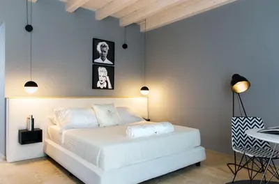 Letto o letti in una camera di CinqueSuites Ortigia