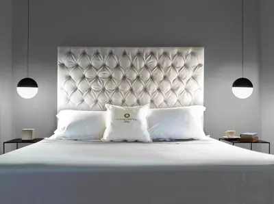 Letto o letti in una camera di CinqueSuites Ortigia