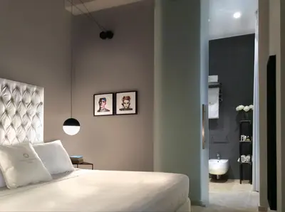 Letto o letti in una camera di CinqueSuites Ortigia
