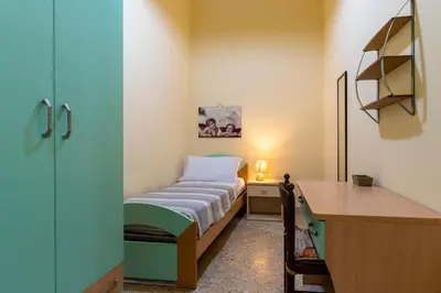 Letto o letti in una camera di La Casa dei Nonni by Wonderful Italy