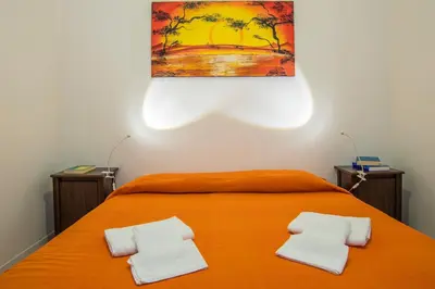 Letto o letti in una camera di Fèdeli House City