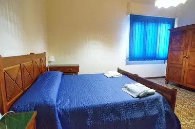 Letto o letti in una camera di Villetta Gina