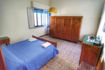 Letto o letti in una camera di Villetta Gina