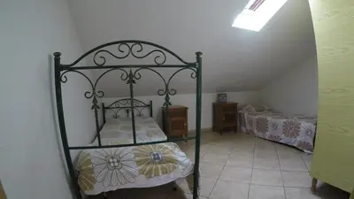 Letto o letti in una camera di Villetta Gina