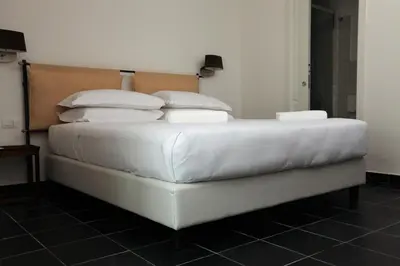 Letto o letti in una camera di Lanterne Magiche Ortigia