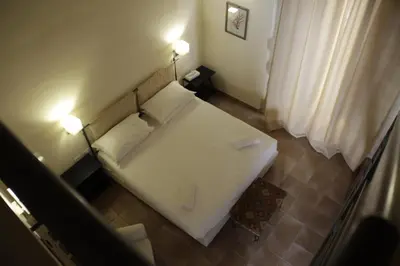 Letto o letti in una camera di Lanterne Magiche Ortigia