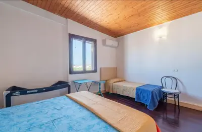 Letto o letti in una camera di Villa con piscina al mare