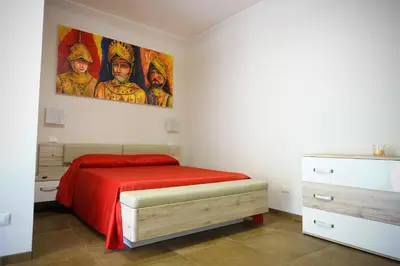Letto o letti in una camera di BB Opera Dei Pupi