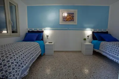 Letto o letti in una camera di Casa Madonna delle Grazie