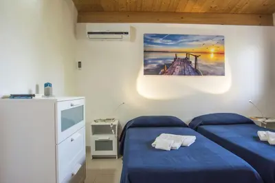 Letto o letti in una camera di Fèdeli House Sea