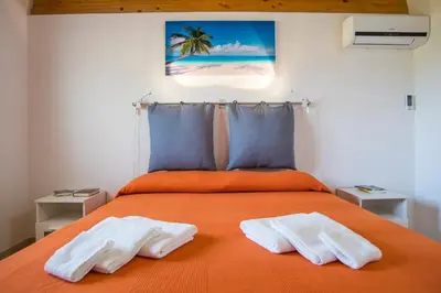 Letto o letti in una camera di Fèdeli House Sea