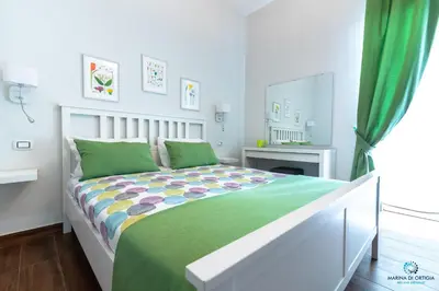 Letto o letti in una camera di B&B Marina di Ortigia