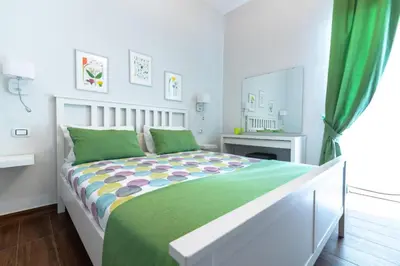 Letto o letti in una camera di B&B Marina di Ortigia
