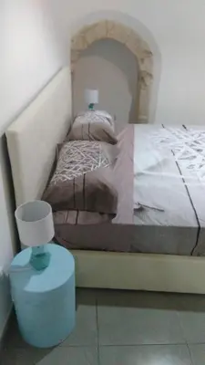 Letto o letti in una camera di La Corte di Aretusa