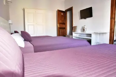 Letto o letti in una camera di Simonetta's Rooms