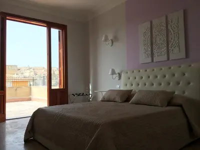 Letto o letti in una camera di Simonetta's Rooms