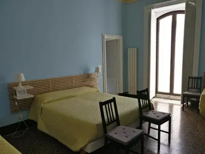 Letto o letti in una camera di B&B Porta della Terra