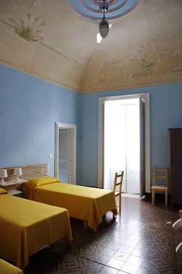 Letto o letti in una camera di B&B Porta della Terra