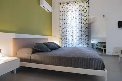 Letto o letti in una camera di Suite Inn Catania