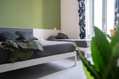 Letto o letti in una camera di Suite Inn Catania