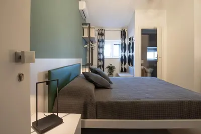 Letto o letti in una camera di Suite Inn Catania