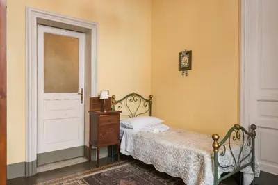 Letto o letti in una camera di Palazzo Arcidiacono - luxury holidays