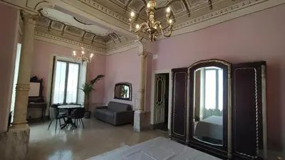 Letto o letti in una camera di Palazzo Arcidiacono - luxury holidays