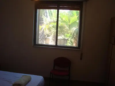 Letto o letti in una camera di Villa degli Angeli