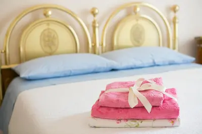 Letto o letti in una camera di Casa Gambuzza