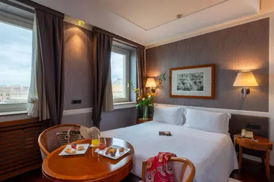 Letto o letti in una camera di Grand Hotel Ortigia