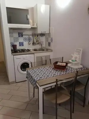 Cucina o angolo cottura di Al Blu Ortigia Apartments