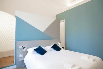 Letto o letti in una camera di Teatro Suites Rooms