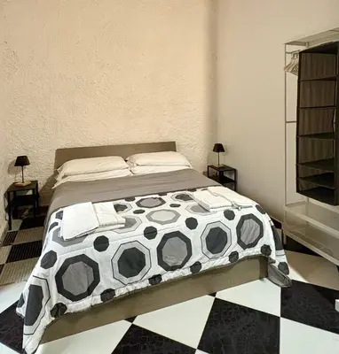 Letto o letti in una camera di Il Cortiletto di Ortigia