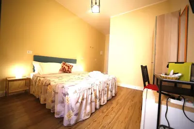 Letto o letti in una camera di Al Quadrato D'Oro rooms