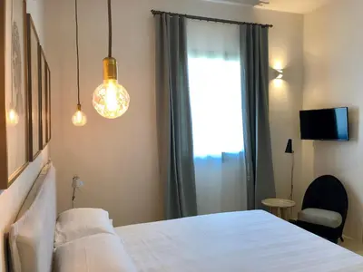 Letto o letti in una camera di Battimandorlo