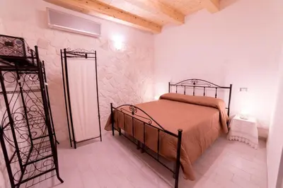 Letto o letti in una camera di Aura Ortigia Apartments