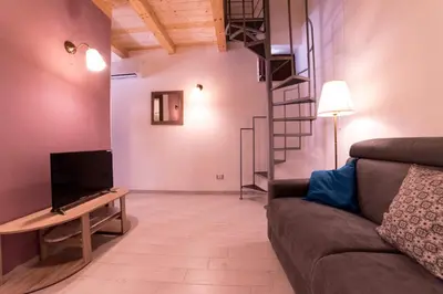 TV o dispositivi per l'intrattenimento presso Aura Ortigia Apartments