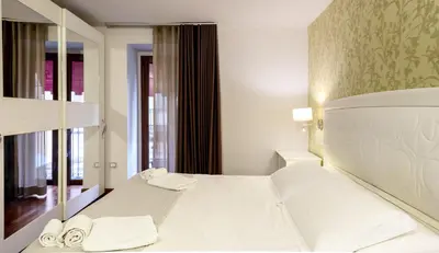 Letto o letti in una camera di Porta Nazionale Dependance