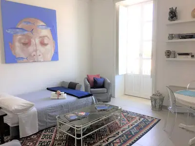 Area soggiorno di Suite 18, casa di charme in Ortigia