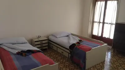 Letto o letti in una camera di B&B Cavour