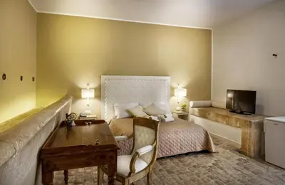 Letto o letti in una camera di Villa Principe Di Belmonte
