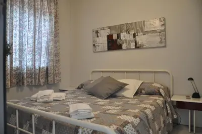 Letto o letti in una camera di Casa Lucia