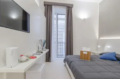 Letto o letti in una camera di Ortigia Bed And Breakfast