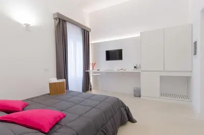Letto o letti in una camera di Ortigia Bed And Breakfast