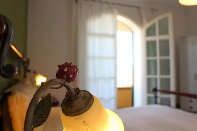 Letto o letti in una camera di Villa Faro Massolivieri