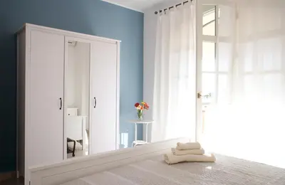 Letto o letti in una camera di Villa Faro Massolivieri